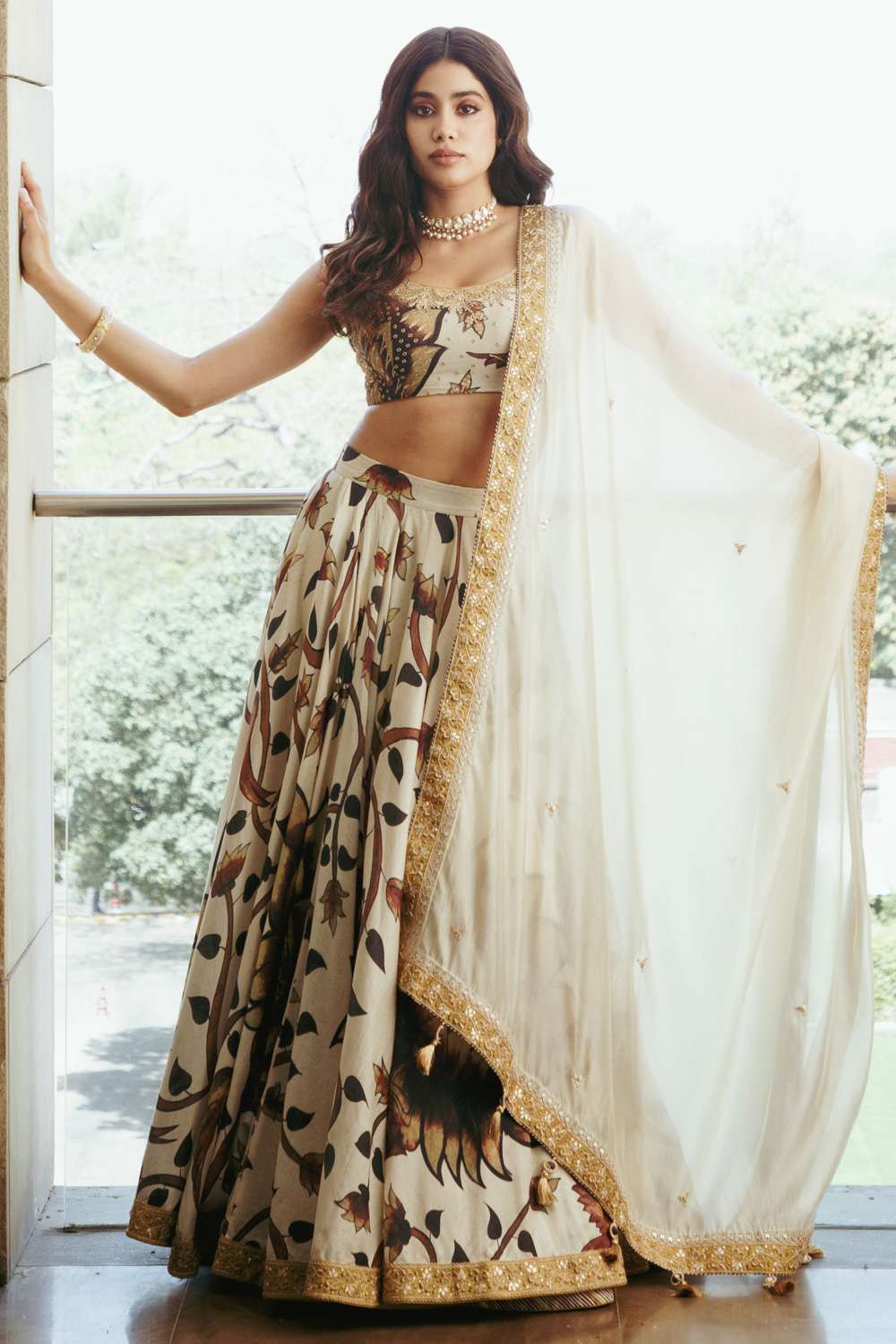 BW66 Off-White & Golden Lehenga GHAGRA CHOLI An off-white and gold brocade  ensemble with a long fully embroidered choli and skirt with embroidered  yoke and panels with a gold dupatta.
