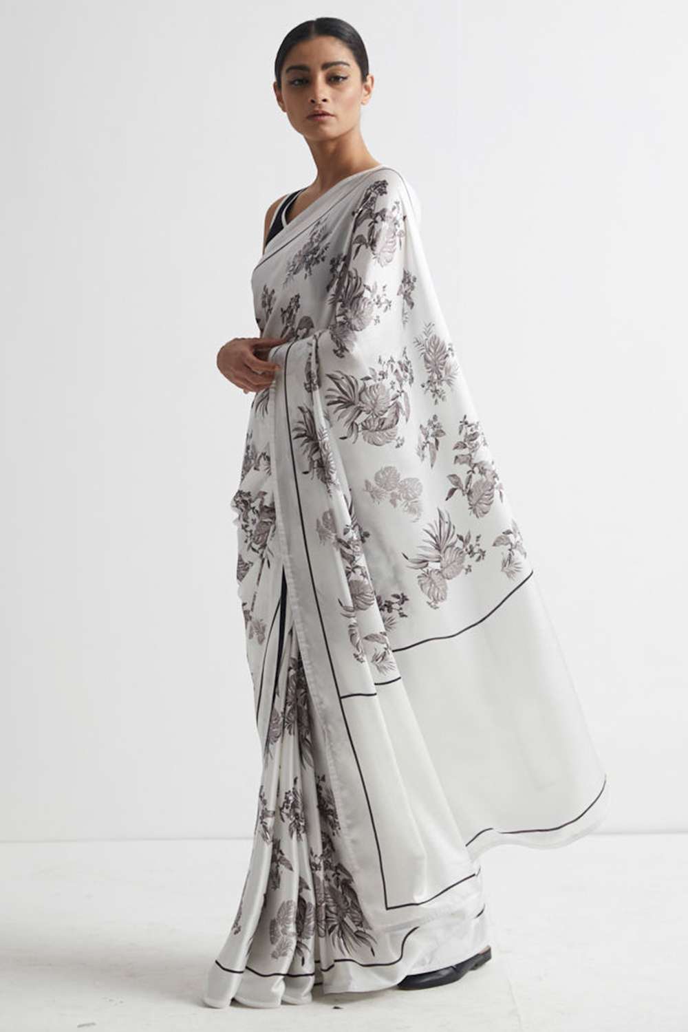 Soft Georgette Saree with Warli Print and Pom -Pom border.